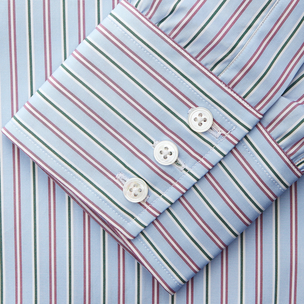 The Turnbull & Asser Blue, Purple & Green Stripe Regular Fit Shirt features a T&A collar and 3 button cuffs, laid flat on a white surface.