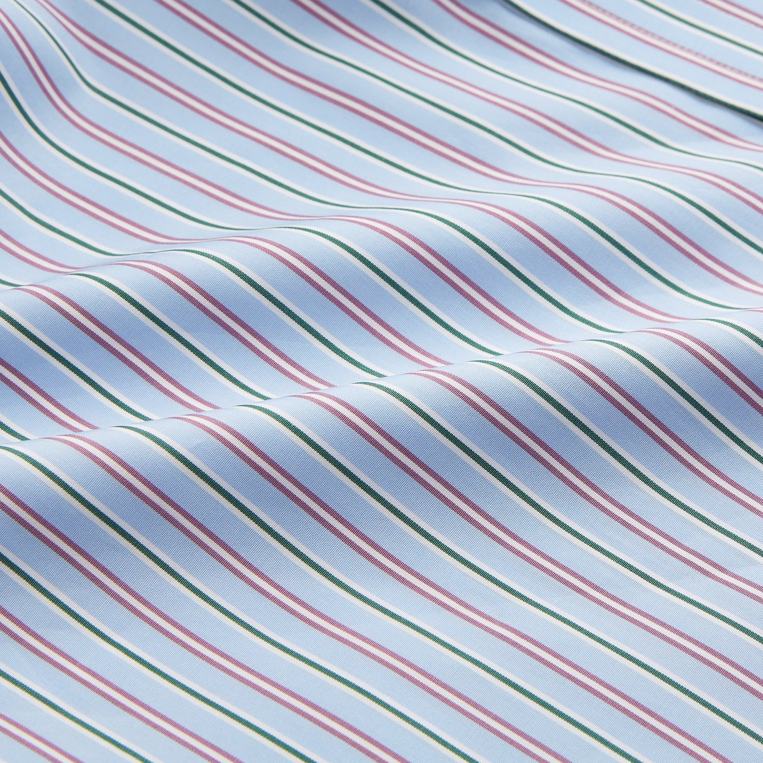 View 4 of product The Turnbull & Asser Blue, Purple & Green Stripe Regular Fit Shirt features a T&A collar and 3 button cuffs, laid flat on a white surface.