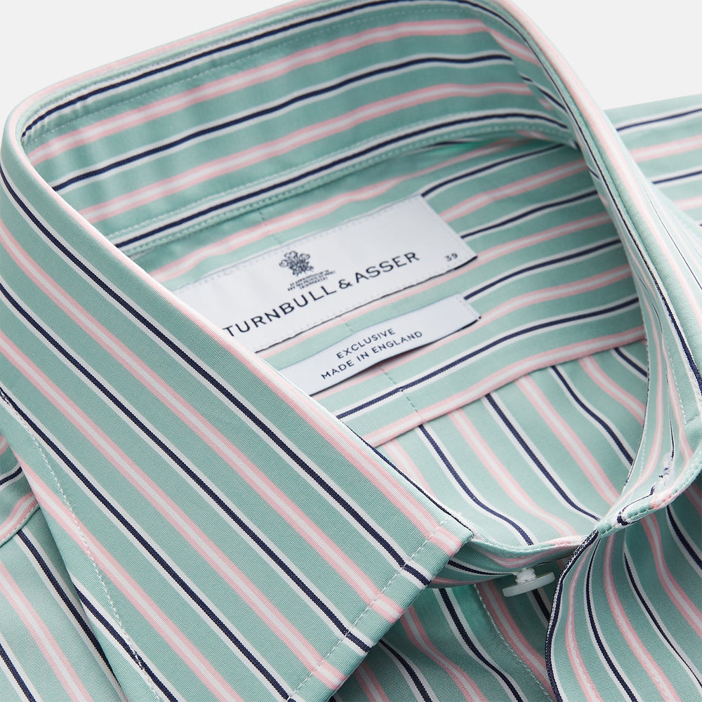 The Turnbull & Asser Green, Navy & Pink Stripe Regular Fit Shirt features a T&A collar, 3 button cuffs, and bold vertical stripes for a classic look.