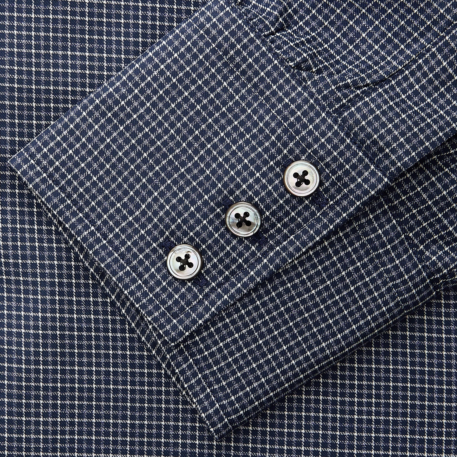 View 5 of product A man in a tie wears the Turnbull & Asser Navy Check Regular Fit Flannel Shirt with T&A collar and 3 button cuffs.