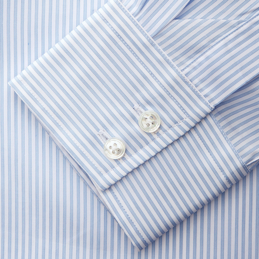 Turnbull & Asser Blue Multi Stripe Tailored Fit Twill Shirt features a Kent collar, 2 button cuffs, and white buttons. Crafted from Italian cotton, it's displayed flat on a white background.