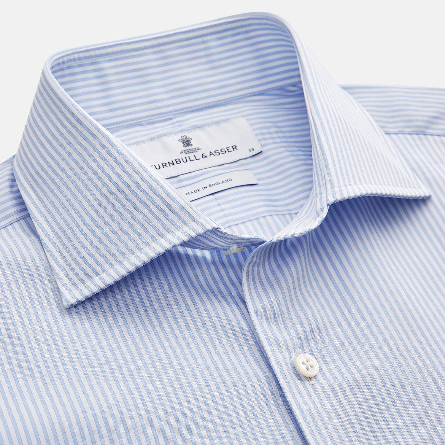 View 2 of product Turnbull & Asser Blue Multi Stripe Tailored Fit Twill Shirt features a Kent collar, 2 button cuffs, and white buttons. Crafted from Italian cotton, it's displayed flat on a white background.