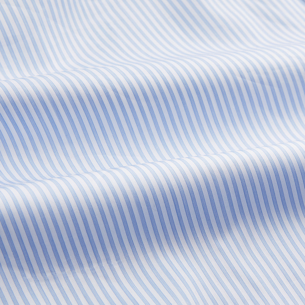 Turnbull & Asser Blue Multi Stripe Tailored Fit Twill Shirt features a Kent collar, 2 button cuffs, and white buttons. Crafted from Italian cotton, it's displayed flat on a white background.