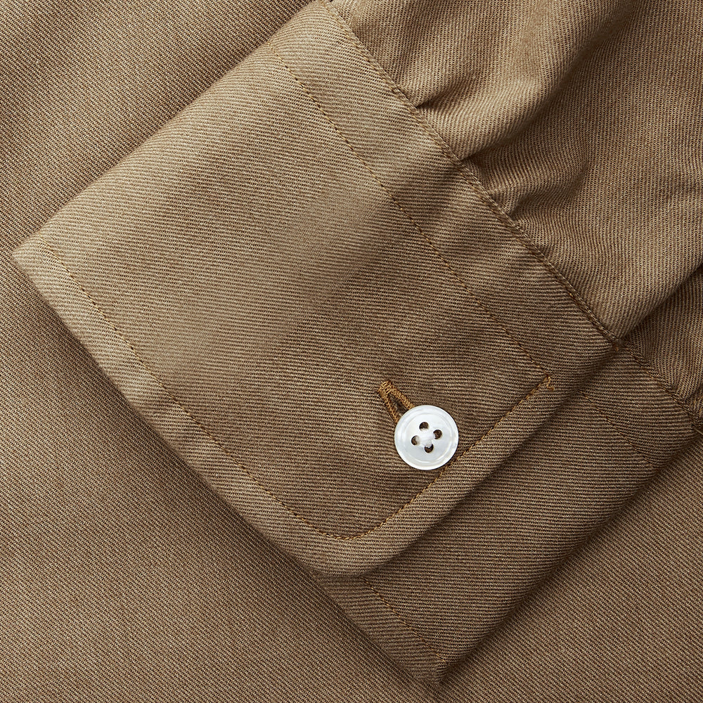The Turnbull & Asser Brown Military Weekend Fit Cotton & Wool Shirt features a stand collar, 1-button cuffs, and two chest flap pockets; shown laid flat on a white background.