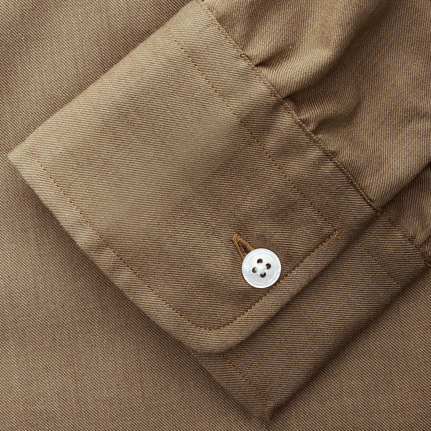 View 4 of product The Turnbull & Asser Brown Military Weekend Fit Cotton & Wool Shirt features a stand collar, 1-button cuffs, and two chest flap pockets; shown laid flat on a white background.