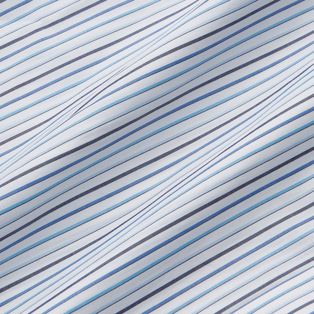 The Turnbull & Asser Blue Multi Blazer Stripe Regular Fit Mayfair Shirt features light blue and white vertical stripes, a signature Mayfair collar, and is neatly displayed on a white background.