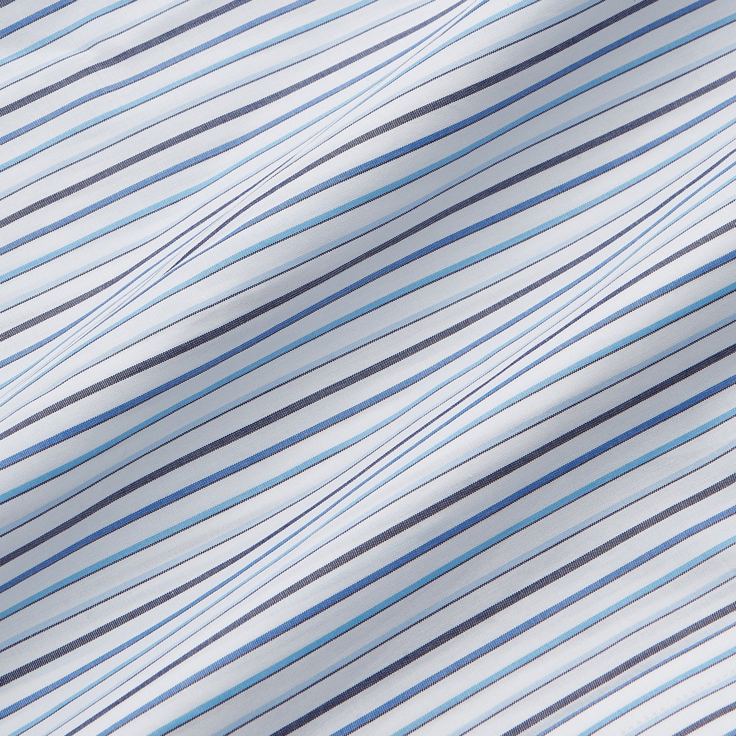 View 4 of product The Turnbull & Asser Blue Multi Blazer Stripe Regular Fit Mayfair Shirt features light blue and white vertical stripes, a signature Mayfair collar, and is neatly displayed on a white background.