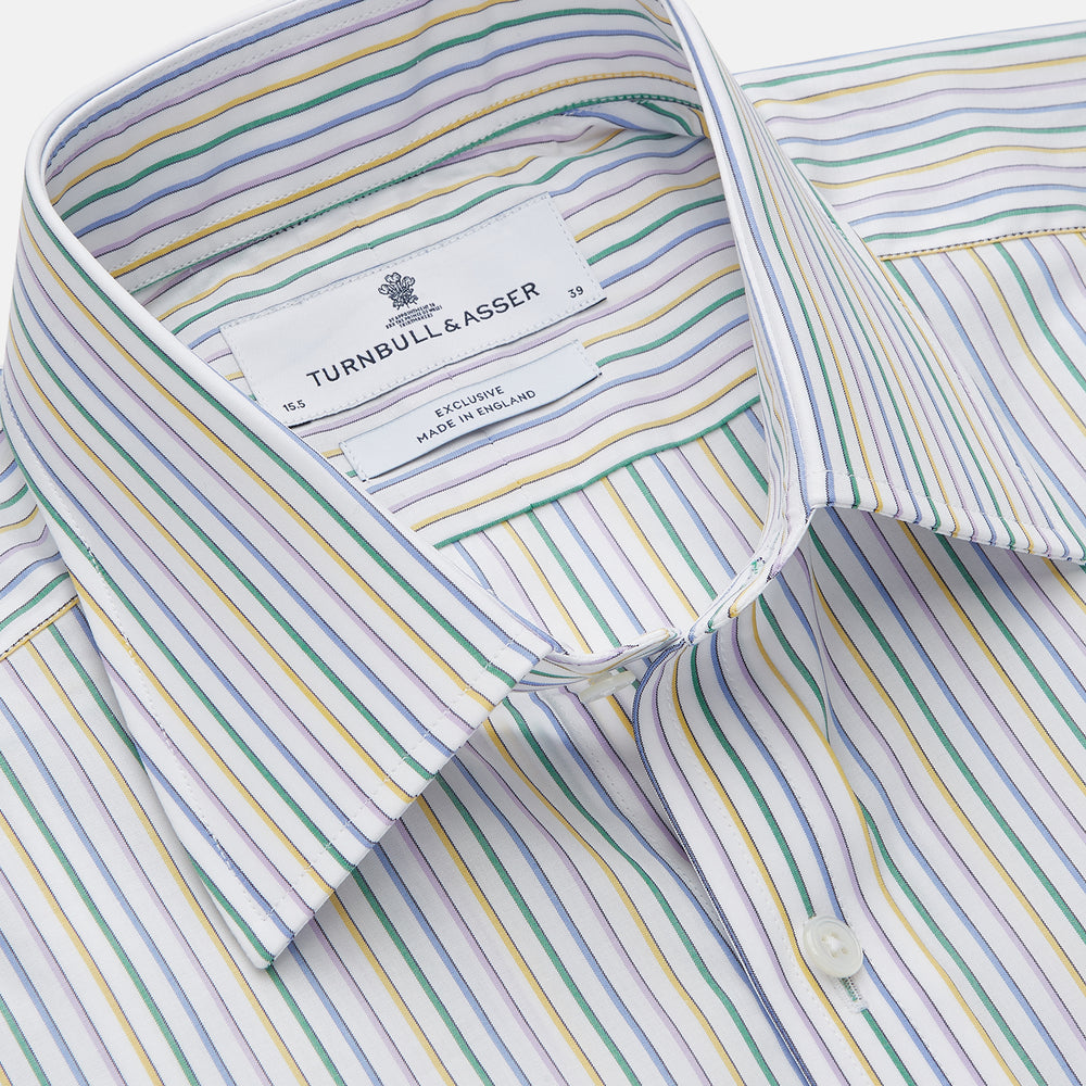 The Turnbull & Asser Yellow Multi Blazer Stripe Regular Fit Mayfair Shirt features a T&A collar and thin blue, yellow, and green stripes on white, shown against a crisp white backdrop.