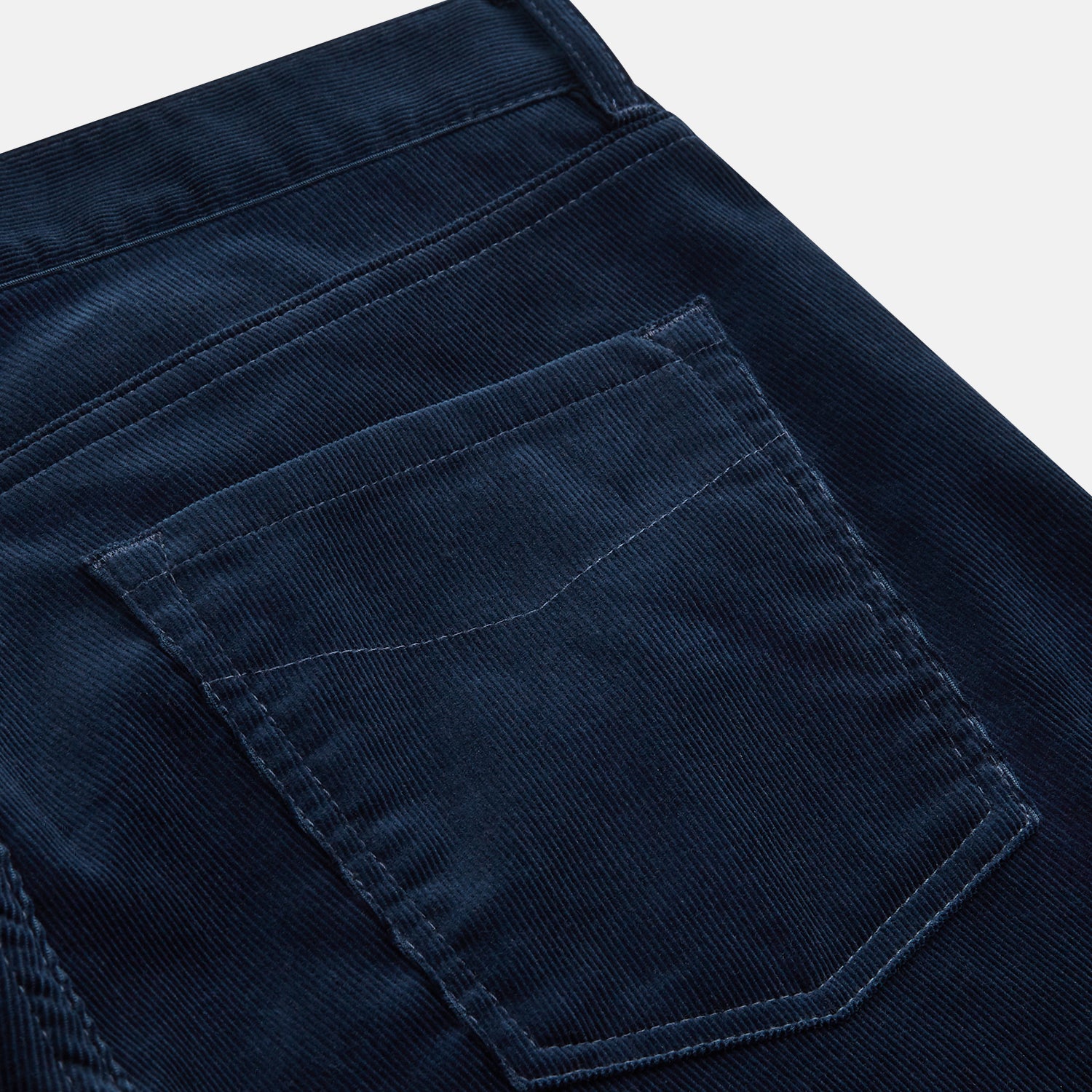 View 3 of product The Turnbull & Asser Petrol Cord Mylo Trousers, featuring a classic five-pocket design, are displayed flat on a plain white background.