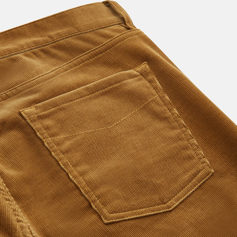 The Caramel Cord Mylo Trousers by Turnbull & Asser, slim-fit with a five-pocket design, are displayed flat on a white background.