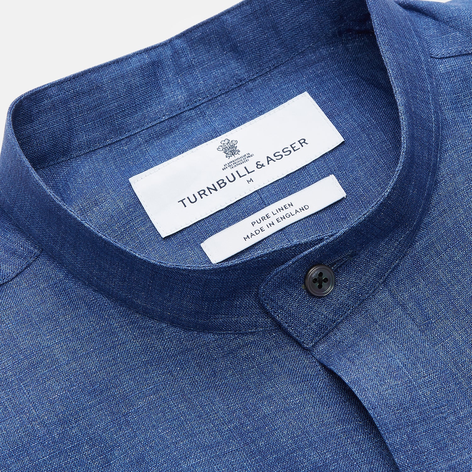 View 2 of product The Turnbull & Asser Navy Linen Weekend Fit Blake Shirt features long sleeves and a stand collar, shown here laid flat on a white background.