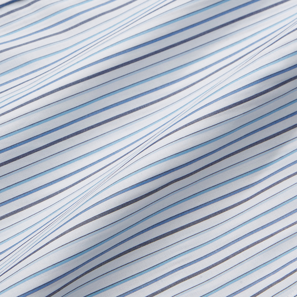 The Turnbull & Asser Blue Multi Blazer Stripe Weekend Fit Suffolk Shirt is a long-sleeved, collared button-up with vertical blue stripes and a chest pocket, shown laid flat on a white background—ideal for casual weekends.