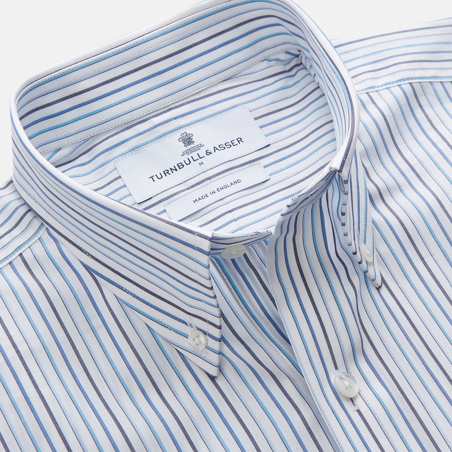 View 2 of product The Turnbull & Asser Blue Multi Blazer Stripe Weekend Fit Suffolk Shirt is a long-sleeved, collared button-up with vertical blue stripes and a chest pocket, shown laid flat on a white background—ideal for casual weekends.
