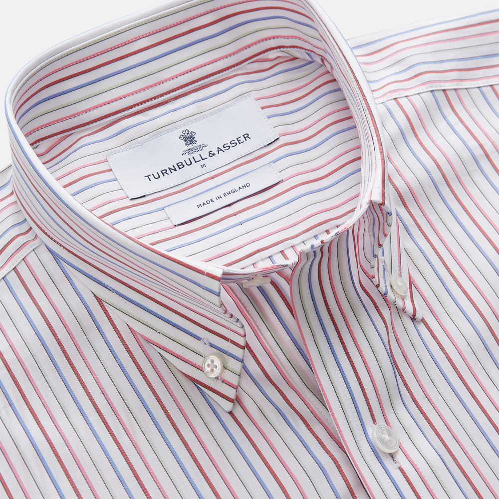 The Turnbull & Asser Red Multi Blazer Stripe Weekend Fit Suffolk Shirt features blue, red, and white stripes, a Dorset collar, single breast pocket, and long sleeves. Displayed flat against a white background.