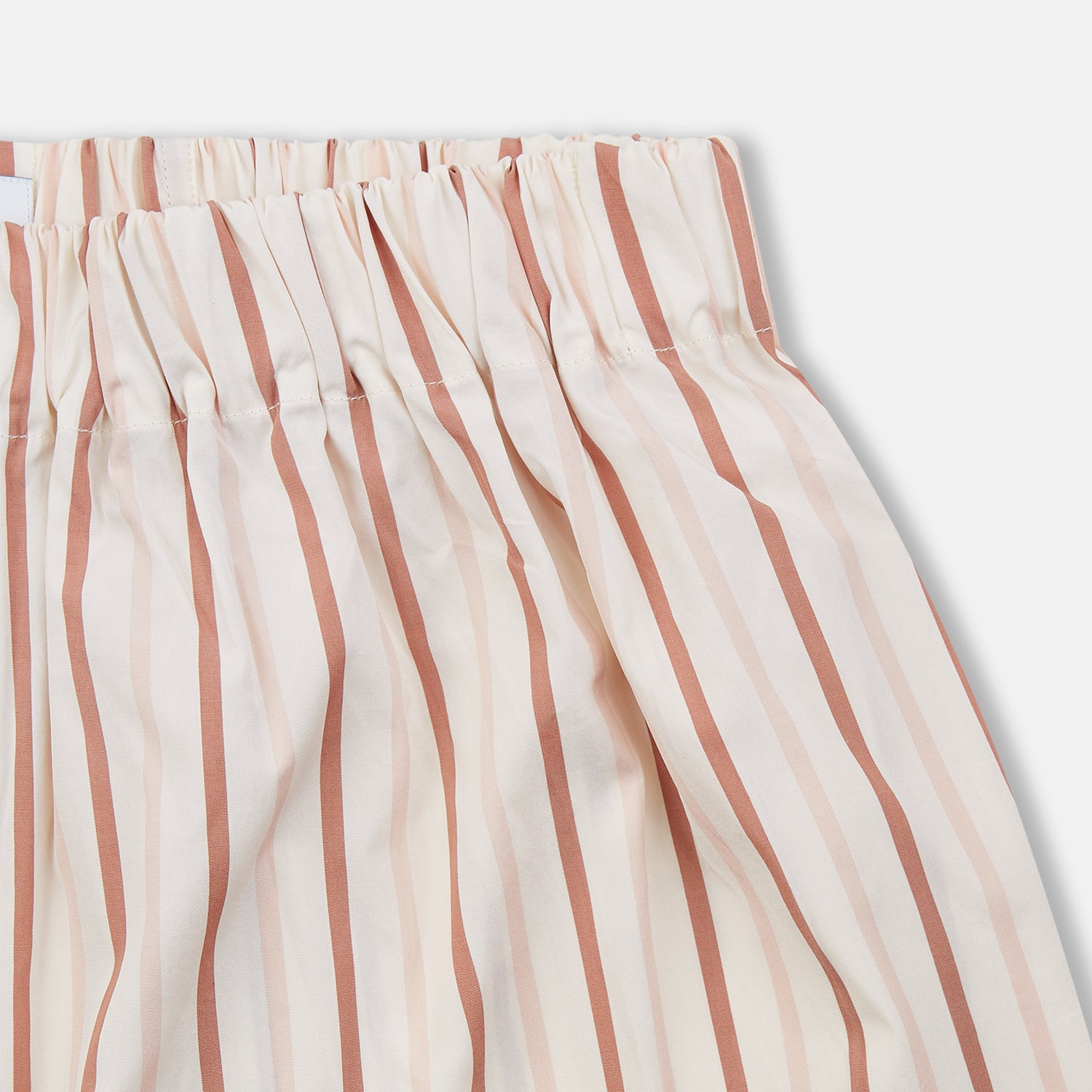 View 2 of product Turnbull & Asser’s Burgundy Multi Striped Cotton Godfrey Boxer Shorts feature a comfortable elastic waistband and stylish vertical red and beige stripes on white—a perfect choice for men’s underwear.