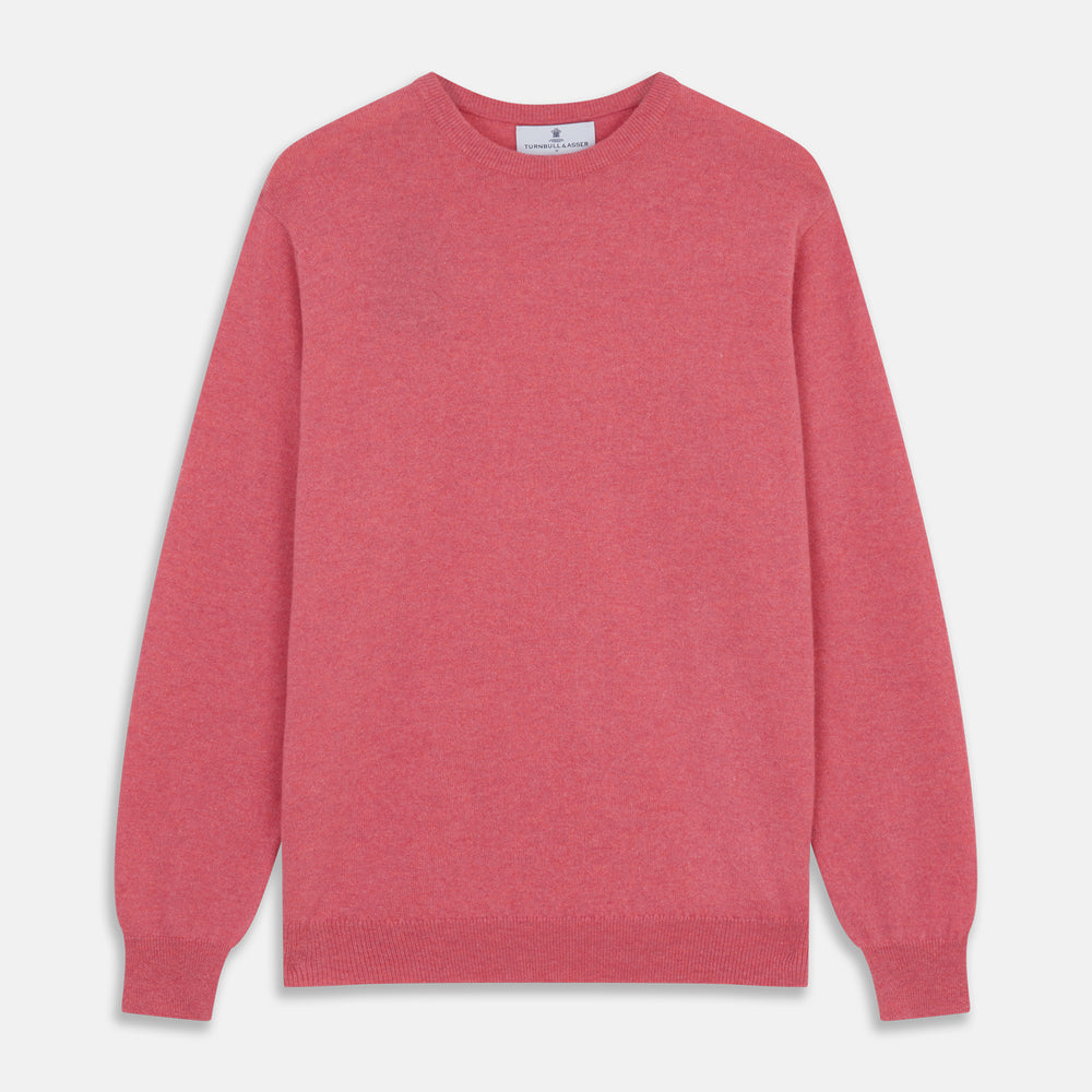 The Turnbull & Asser Pink Cashmere Glenn Jumper is a solid pink, long-sleeved menswear sweater with a crewneck, shown laid flat on a white background.