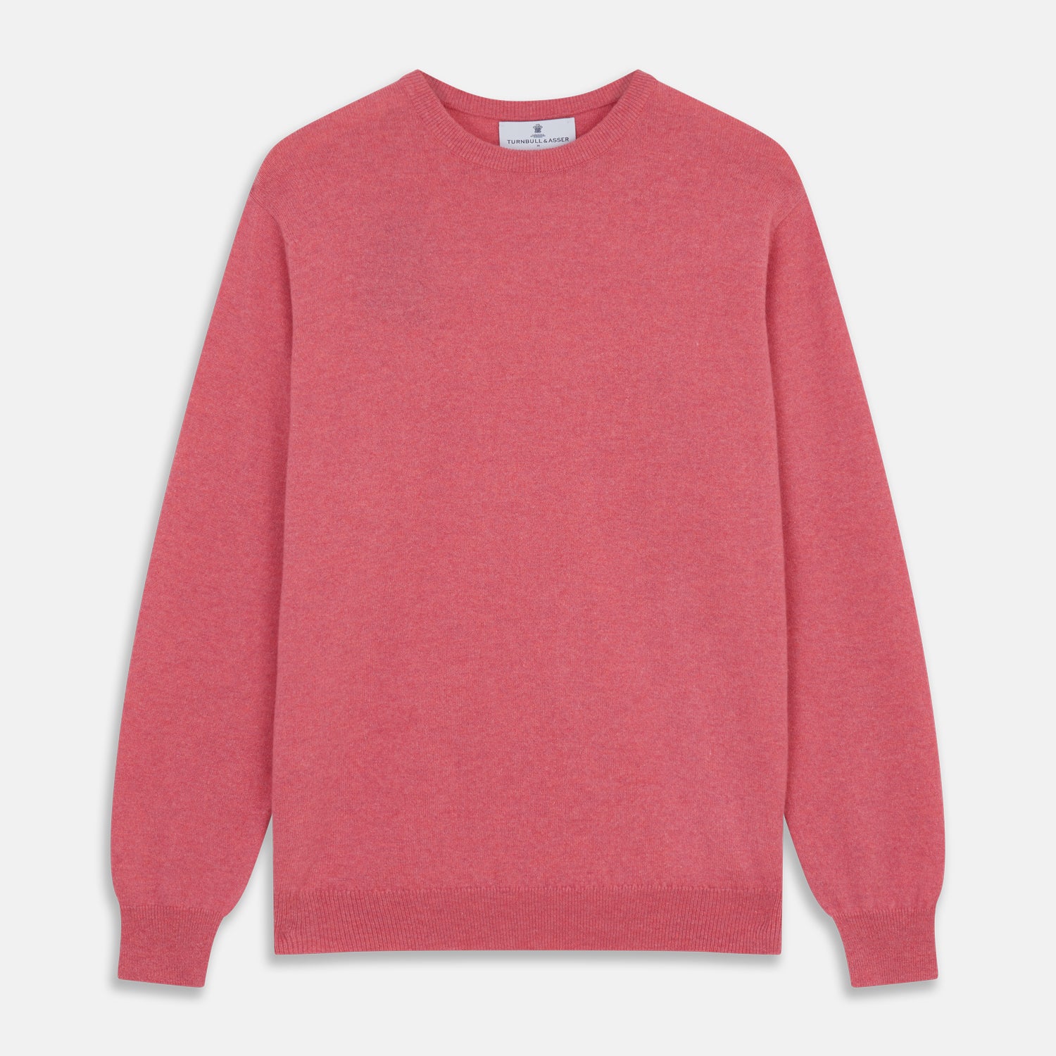 View 1 of product The Turnbull & Asser Pink Cashmere Glenn Jumper is a solid pink, long-sleeved menswear sweater with a crewneck, shown laid flat on a white background.