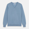 View 1 of product The Turnbull & Asser Pale Blue Cashmere Paden V-Neck Jumper features long sleeves, ribbed cuffs and hem, and is shown laid flat on a white background—an ideal choice for men's style.