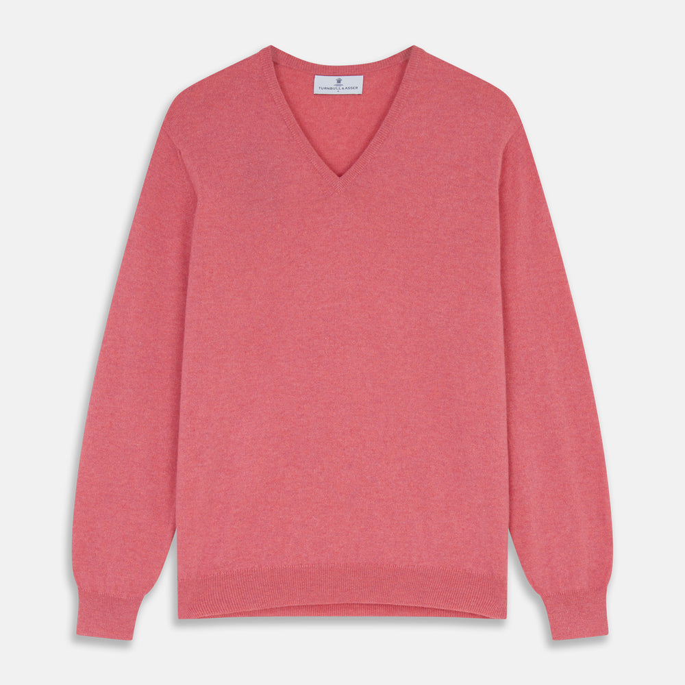 The Pink Cashmere Paden V-Neck Jumper by Turnbull & Asser, knitted in Scotland, is shown laid flat on a white background. This long-sleeved sweater features ribbed cuffs, hem, and neckline.