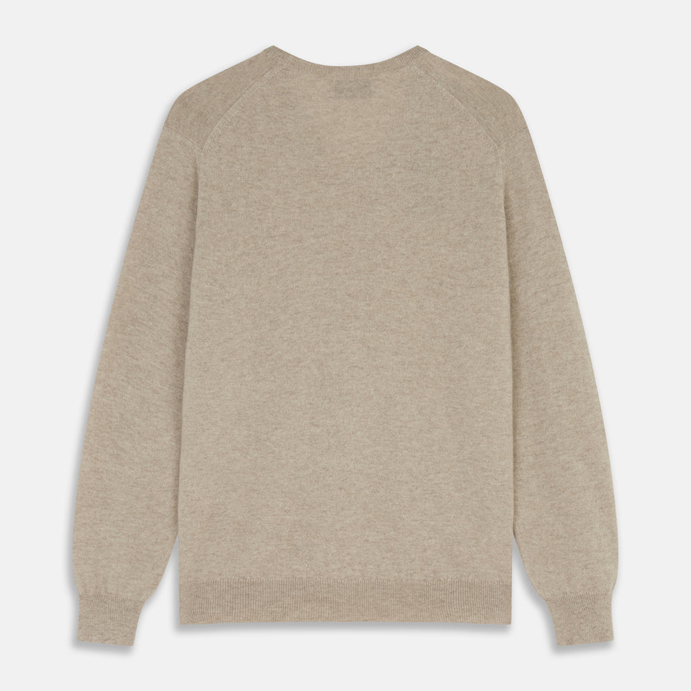 The Turnbull & Asser Beige Cashmere Paden V-Neck Jumper is laid flat on a white background. Knitted in Scotland, this men's staple features ribbed cuffs, hem, and neckline with a soft, smooth texture.
