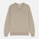 The Turnbull & Asser Beige Cashmere Paden V-Neck Jumper is laid flat on a white background. Knitted in Scotland, this men's staple features ribbed cuffs, hem, and neckline with a soft, smooth texture.