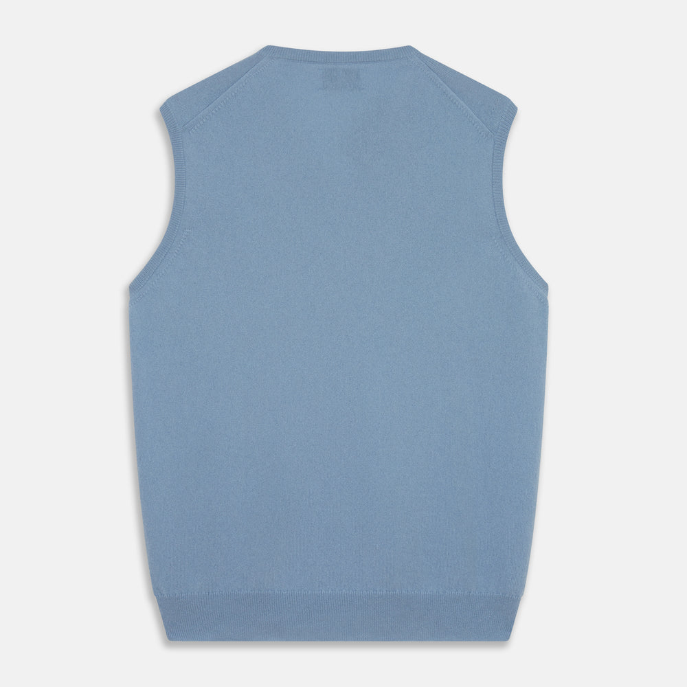 The Turnbull & Asser Pale Blue Cashmere Ifor Slipover is a sleeveless V-neck sweater vest with ribbed edges, shown laid flat on a white background—a classic menswear staple.