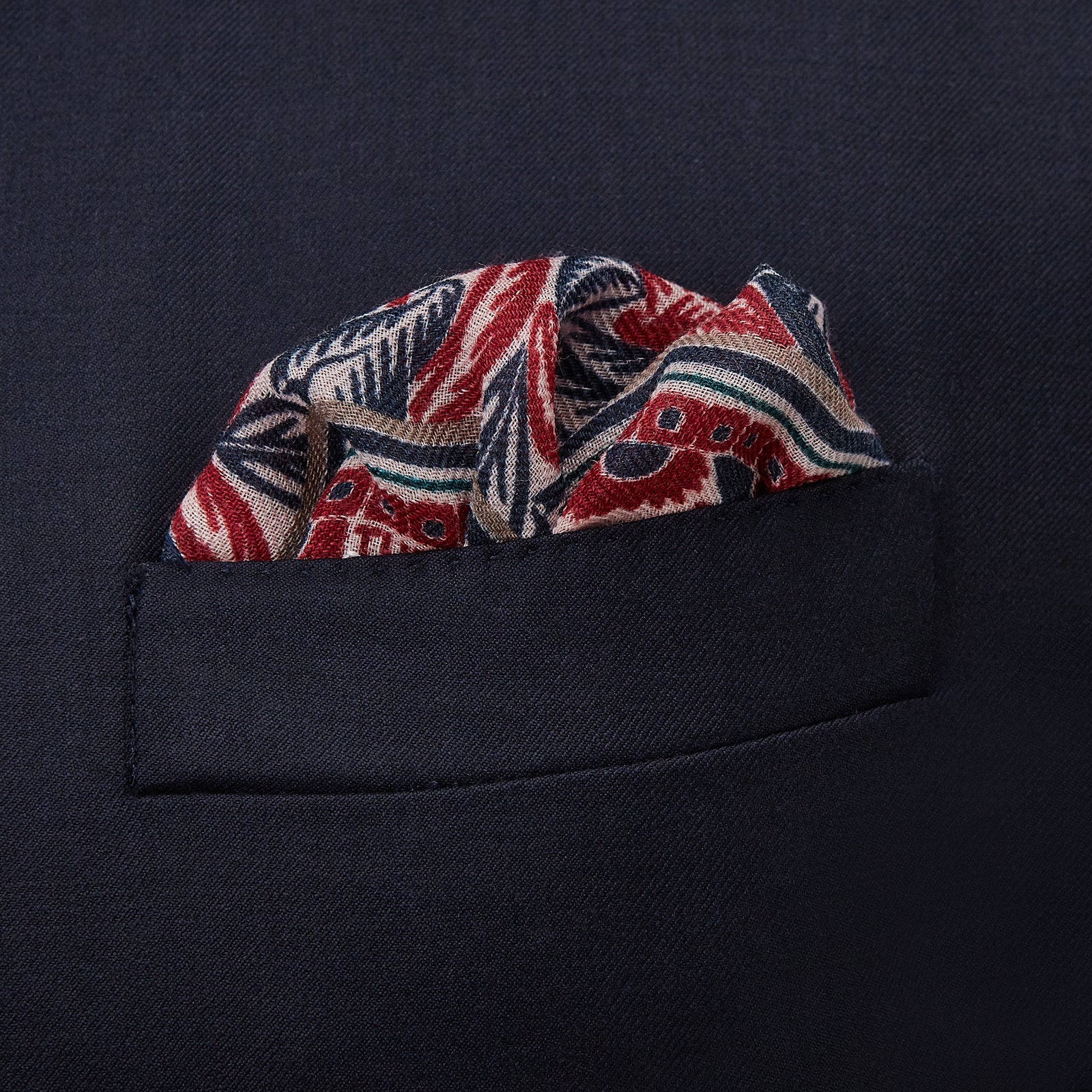 View 2 of product The Turnbull & Asser Pink And Blue Tropical Bird Pattern Wool Pocket Square is a lightweight accessory, featuring vibrant pink and blue birds on wool with a bold geometric border.