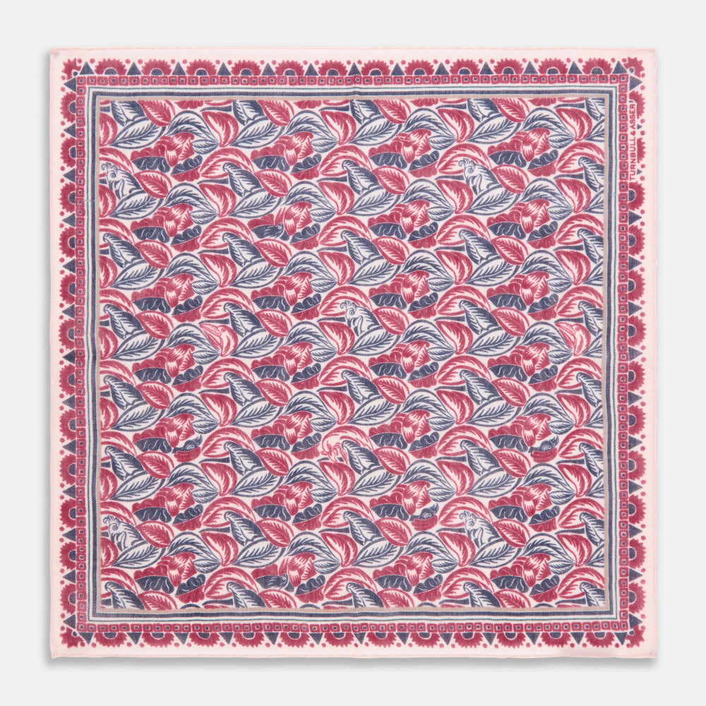 The Turnbull & Asser Pink And Blue Tropical Bird Pattern Wool Pocket Square is a lightweight accessory, featuring vibrant pink and blue birds on wool with a bold geometric border.