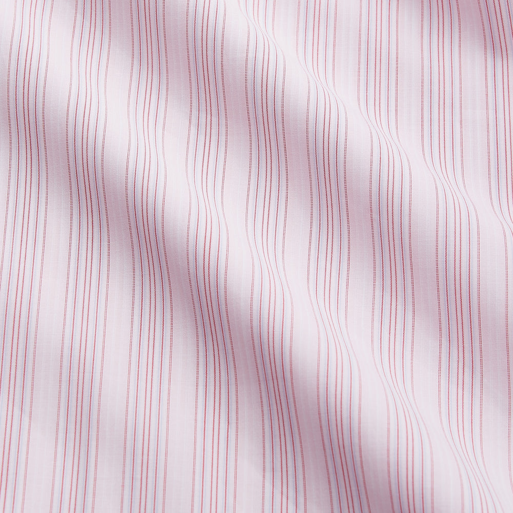 The Pink and Peach Multi Stripe Cotton Regular Fit Whitby Shirt by Turnbull & Asser features long sleeves, double cuffs, a button-down front, and a classic collar; shown laid flat on a white background.