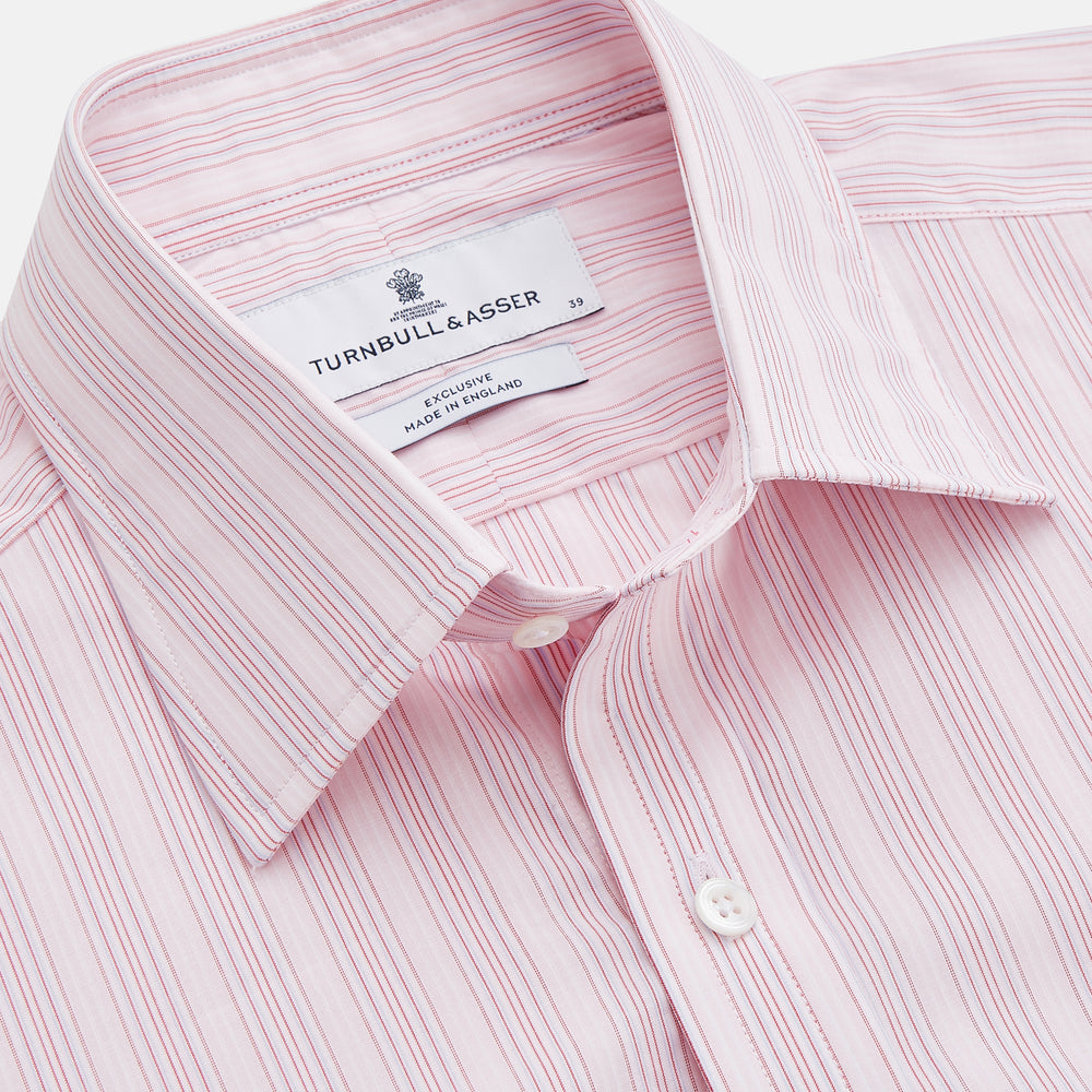 The Pink and Peach Multi Stripe Cotton Regular Fit Whitby Shirt by Turnbull & Asser features long sleeves, double cuffs, a button-down front, and a classic collar; shown laid flat on a white background.