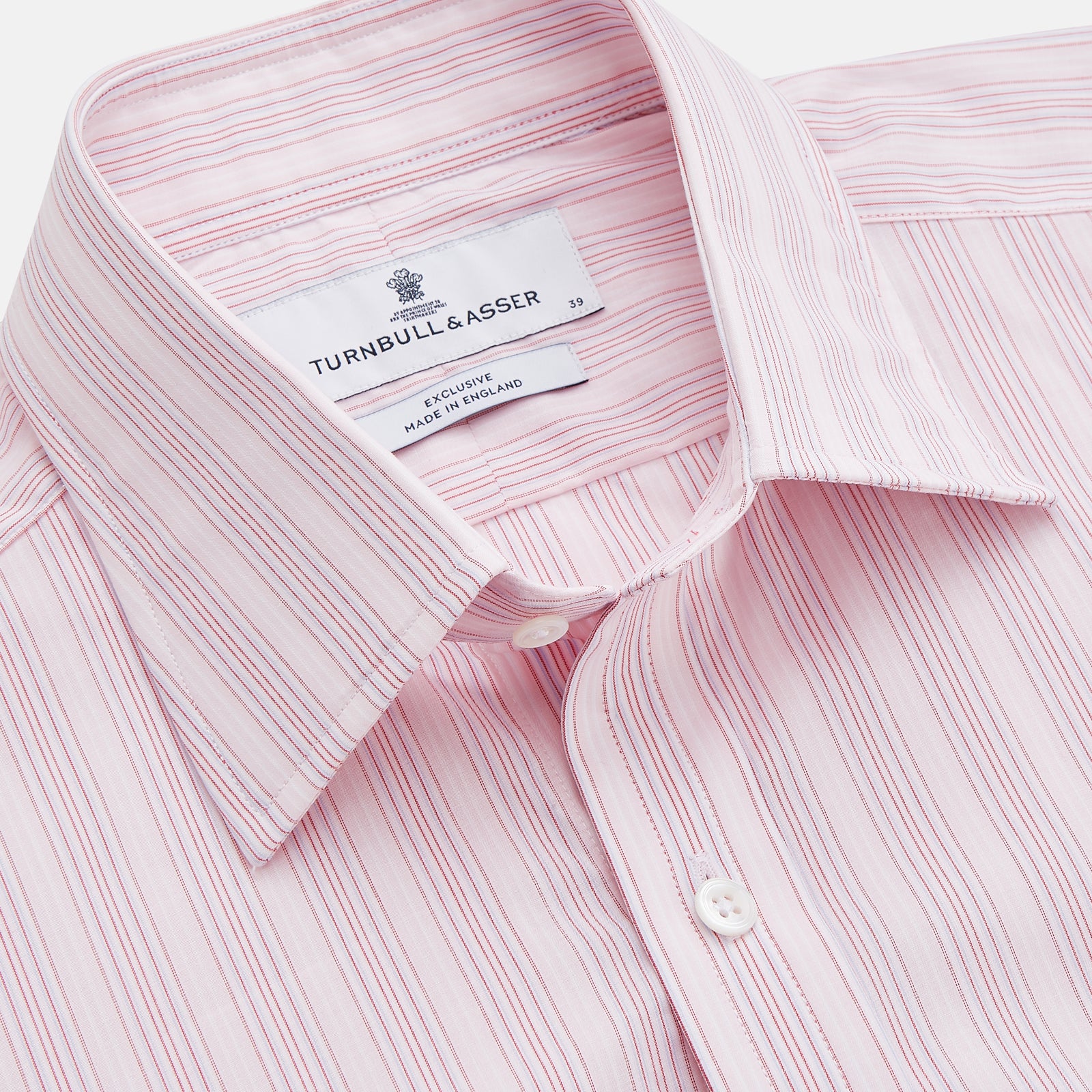 View 2 of product The Pink and Peach Multi Stripe Cotton Regular Fit Whitby Shirt by Turnbull & Asser features long sleeves, double cuffs, a button-down front, and a classic collar; shown laid flat on a white background.