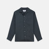 View 1 of product The Turnbull & Asser Grey Cotton and Linen Blend Holiday Fit Winnington Shirt features long sleeves, a spread collar, a left chest pocket, and white buttons, shown against a plain white background.