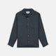 The Turnbull & Asser Grey Cotton and Linen Blend Holiday Fit Winnington Shirt features long sleeves, a spread collar, a left chest pocket, and white buttons, shown against a plain white background.