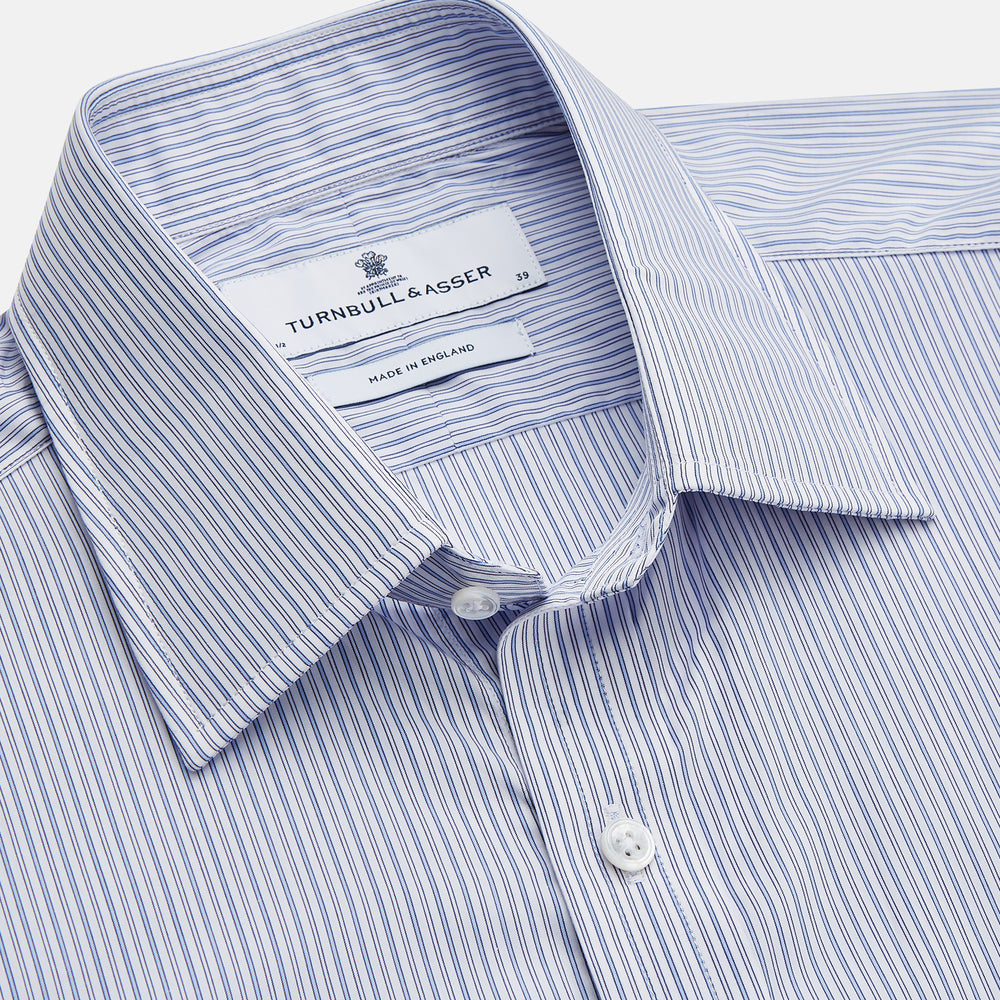 The Turnbull & Asser Blue Multi Stripe Cotton Regular Fit Whitby Shirt features long sleeves, a classic collar, button-down front, and double cuffs, shown laid flat on a white background.