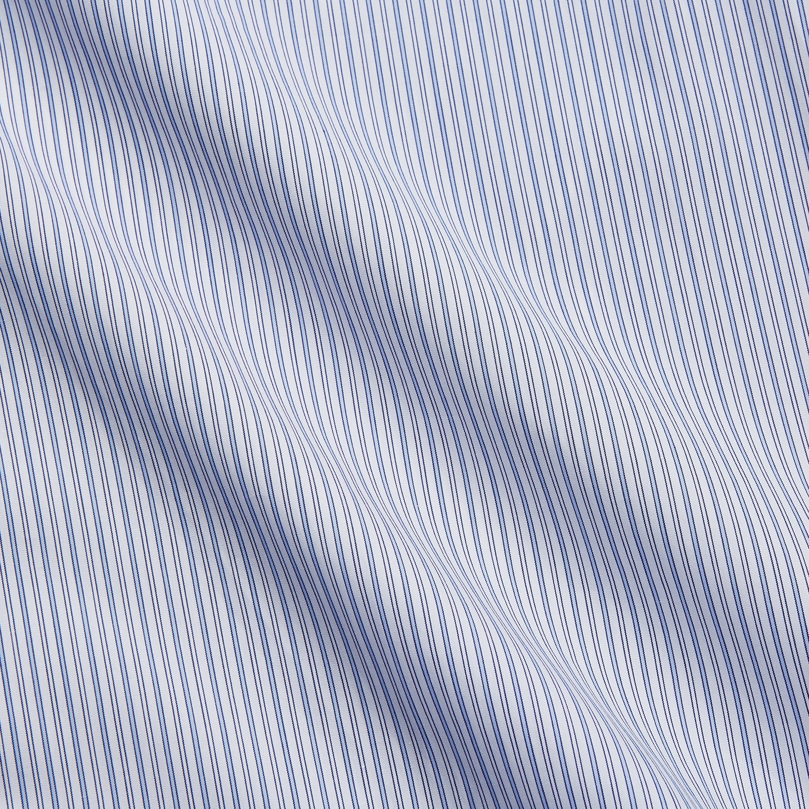 View 4 of product The Turnbull & Asser Blue Multi Stripe Cotton Regular Fit Whitby Shirt features long sleeves, a classic collar, button-down front, and double cuffs, shown laid flat on a white background.