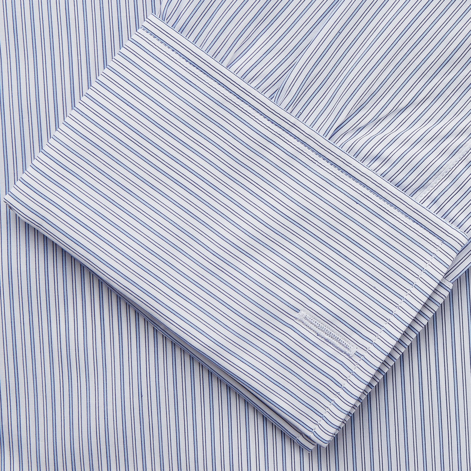 View 3 of product The Turnbull & Asser Blue Multi Stripe Cotton Regular Fit Whitby Shirt features long sleeves, a classic collar, button-down front, and double cuffs, shown laid flat on a white background.