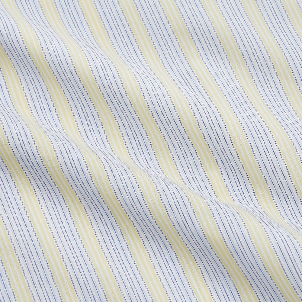 The Yellow and Pale Blue Multi Stripe Cotton Regular Fit Whitby Shirt by Turnbull & Asser features light blue and yellow stripes on white, a classic collar, white buttons, long sleeves, and wide double cuffs.
