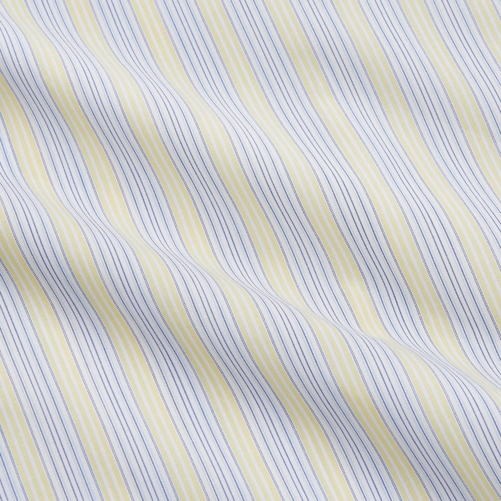 View 4 of product The Yellow and Pale Blue Multi Stripe Cotton Regular Fit Whitby Shirt by Turnbull & Asser features light blue and yellow stripes on white, a classic collar, white buttons, long sleeves, and wide double cuffs.