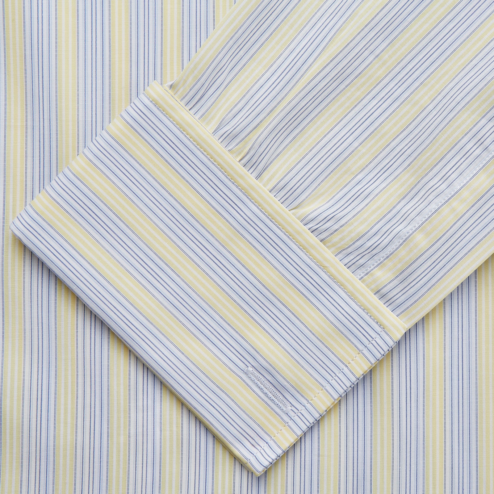 View 3 of product The Yellow and Pale Blue Multi Stripe Cotton Regular Fit Whitby Shirt by Turnbull & Asser features light blue and yellow stripes on white, a classic collar, white buttons, long sleeves, and wide double cuffs.