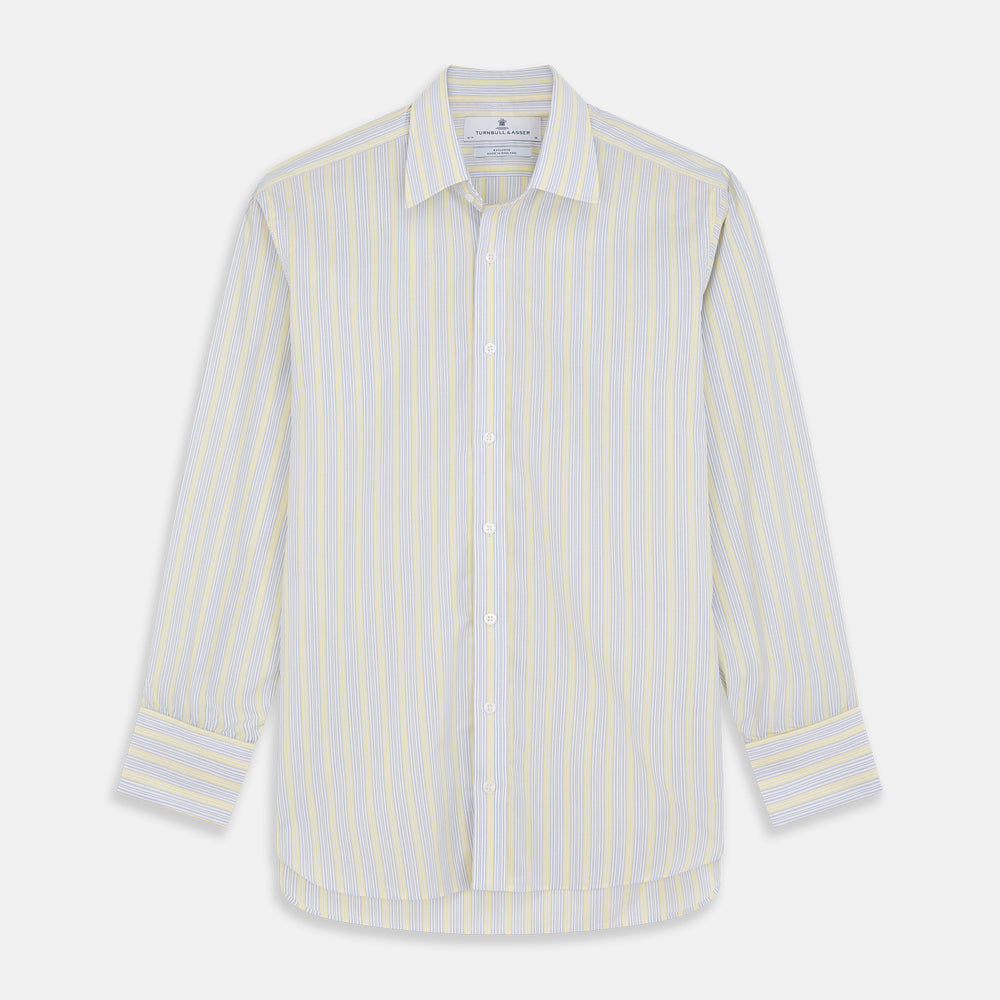 The Yellow and Pale Blue Multi Stripe Cotton Regular Fit Whitby Shirt by Turnbull & Asser features light blue and yellow stripes on white, a classic collar, white buttons, long sleeves, and wide double cuffs.