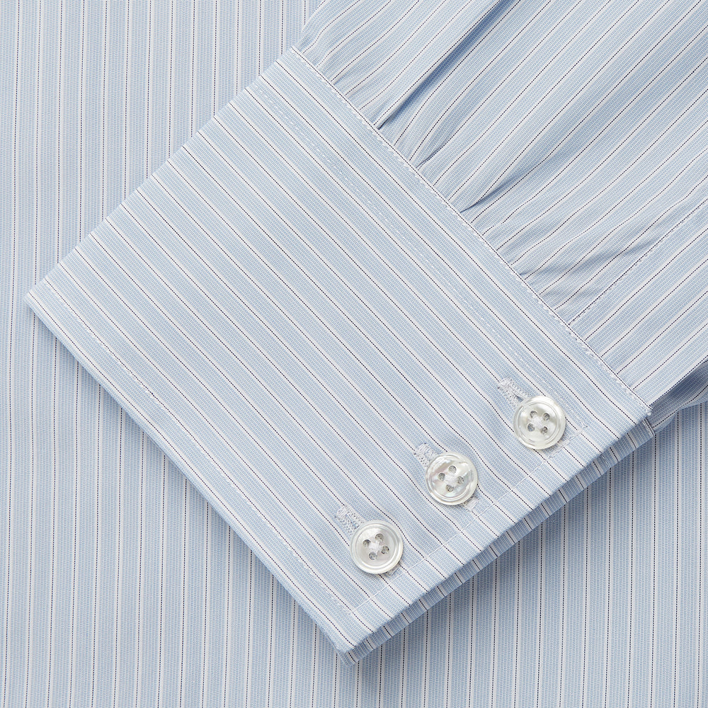 The Turnbull & Asser Pale Blue Stripe West Indian Sea Island Cotton Regular Fit Mayfair Shirt features long sleeves, a button-down front, and a classic collar—an essential for any men's wardrobe, shown on a plain white background.