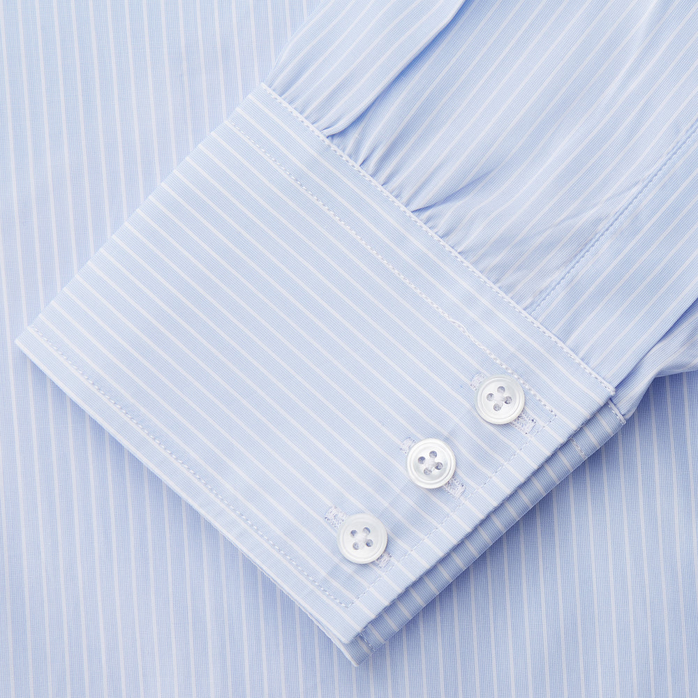 The Light Blue Multi-stripe Cotton Regular Fit Mayfair Shirt by Turnbull & Asser features a T&A collar, button-down front, and buttoned cuffs, displayed flat against a white background.