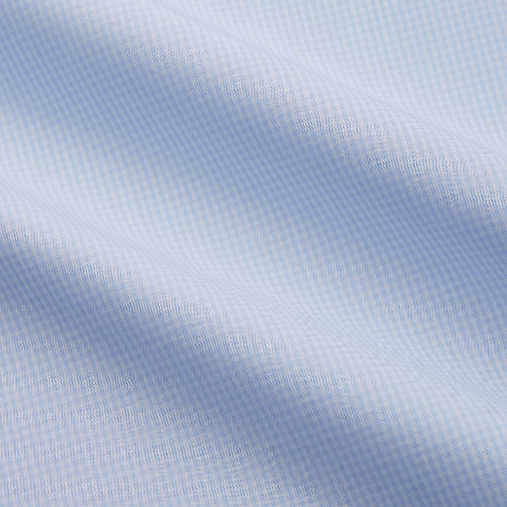 The Light Blue Multi-Check Cotton Regular Fit Mayfair Shirt by Turnbull & Asser is shown laid flat, featuring a classic T&A collar, front buttons, and buttoned cuffs on a white background.