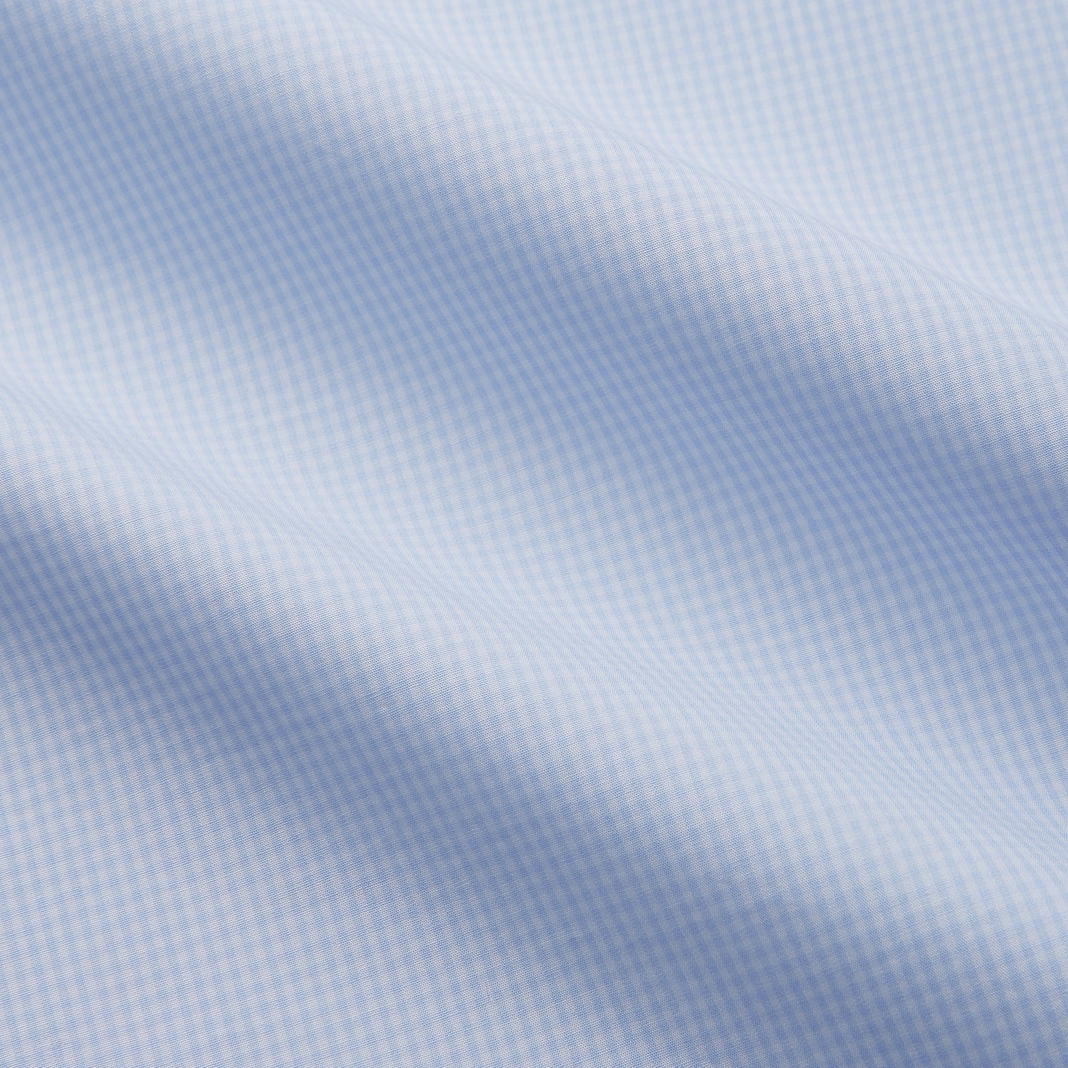 View 2 of product The Light Blue Multi-Check Cotton Regular Fit Mayfair Shirt by Turnbull & Asser is shown laid flat, featuring a classic T&A collar, front buttons, and buttoned cuffs on a white background.
