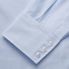 View 4 of product The Light Blue Multi-Check Cotton Regular Fit Mayfair Shirt by Turnbull & Asser is shown laid flat, featuring a classic T&A collar, front buttons, and buttoned cuffs on a white background.