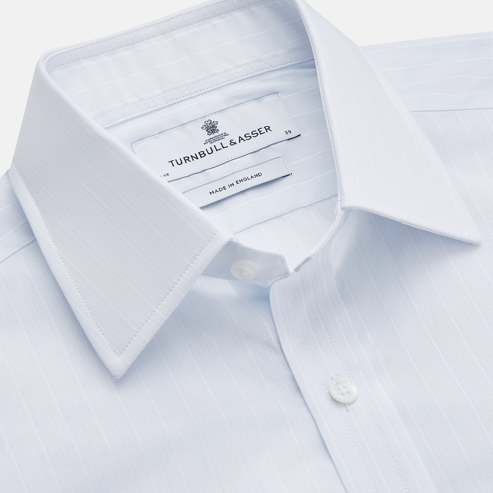 View 2 of product A Cloudy Blue Stripe Cotton Regular Fit Mayfair Shirt by Turnbull & Asser, featuring a T&A collar and button-down front, is laid flat on a plain white background.