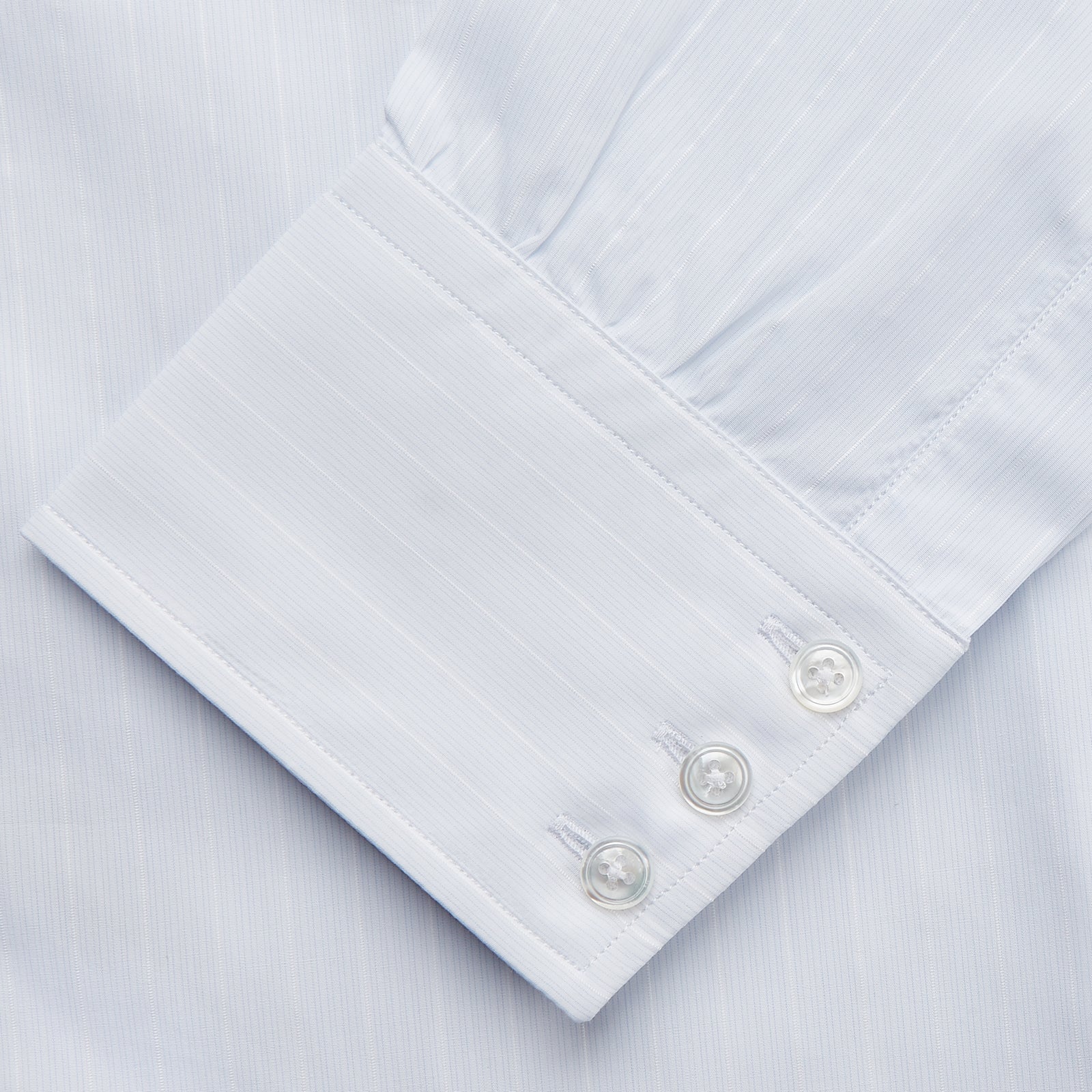 View 3 of product A Cloudy Blue Stripe Cotton Regular Fit Mayfair Shirt by Turnbull & Asser, featuring a T&A collar and button-down front, is laid flat on a plain white background.