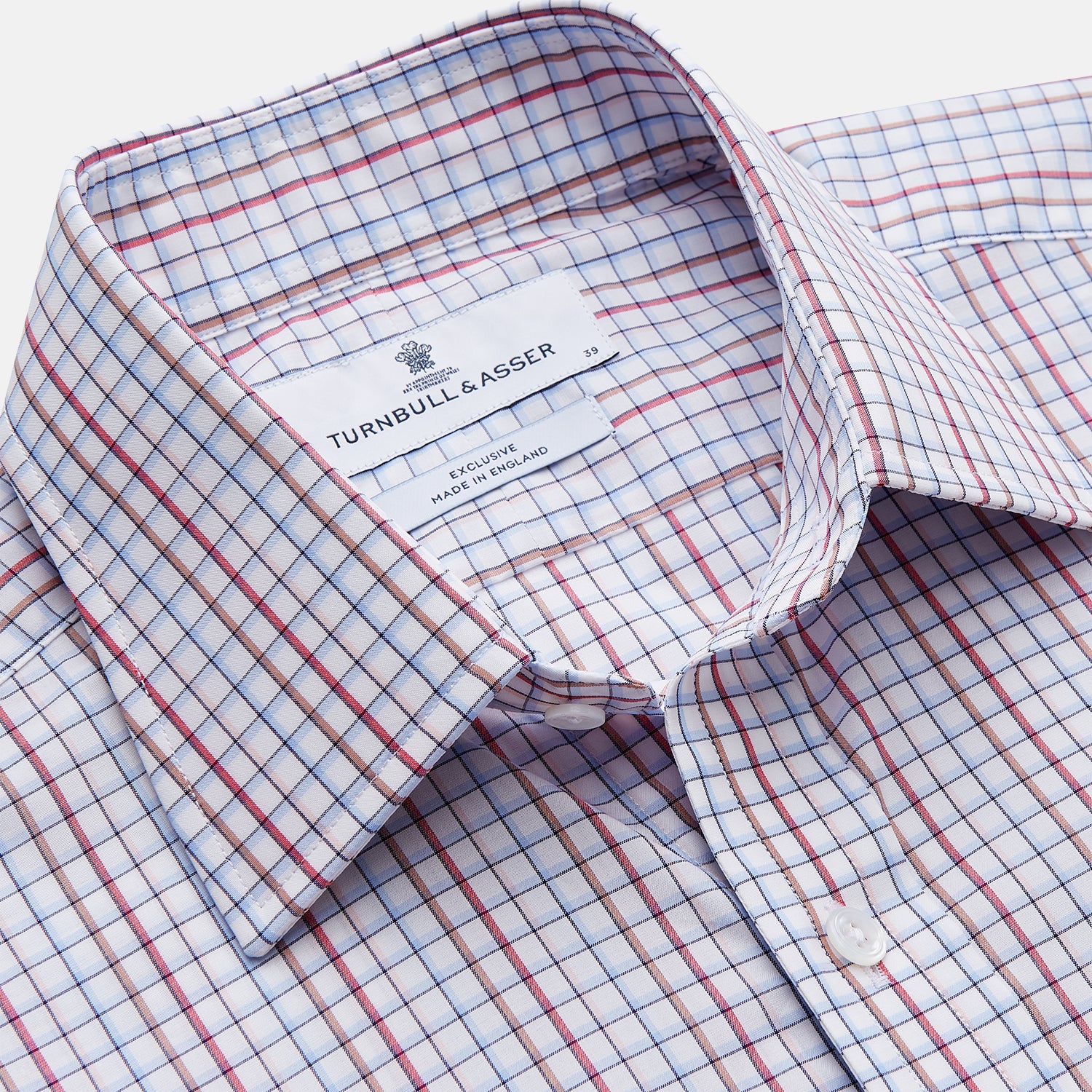 View 2 of product The Turnbull & Asser Red Multi-check Cotton Regular Fit Mayfair Shirt for men features a T&A collar, button cuffs, and a small red check pattern, shown laid flat on a white background.