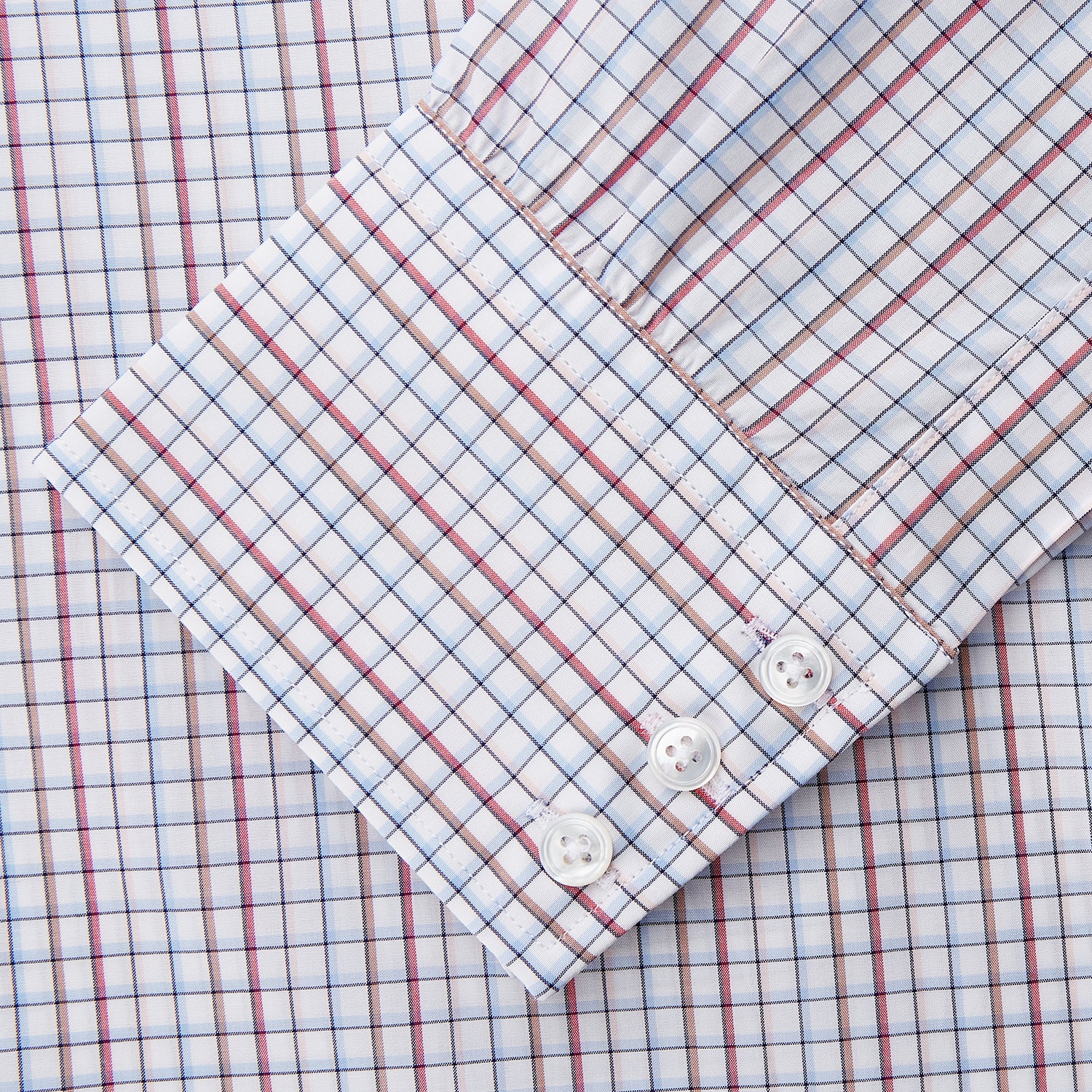 View 3 of product The Turnbull & Asser Red Multi-check Cotton Regular Fit Mayfair Shirt for men features a T&A collar, button cuffs, and a small red check pattern, shown laid flat on a white background.