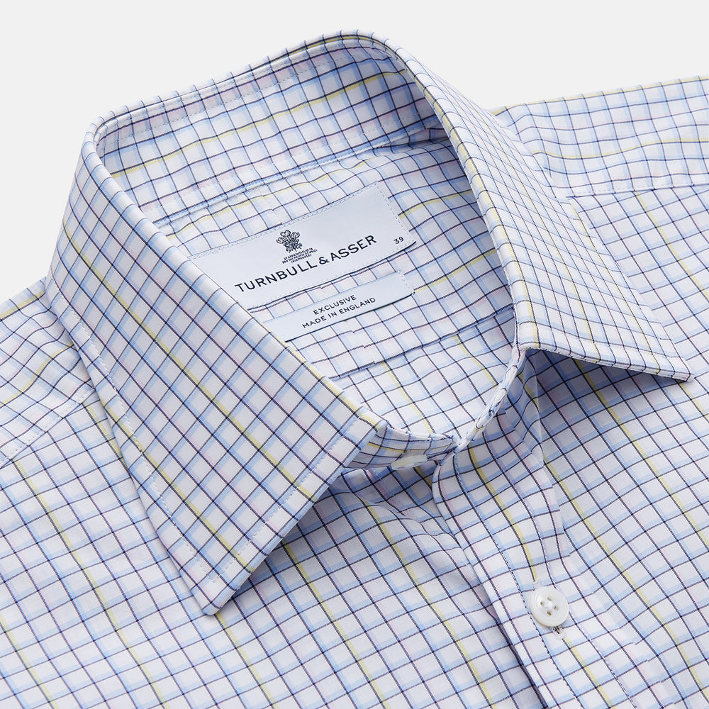 The Turnbull & Asser Purple Multi-check Cotton Mayfair Shirt is a men’s long-sleeve, button-up dress shirt with a T&A collar, featuring a purple multi-check pattern and shown flat on a white background.